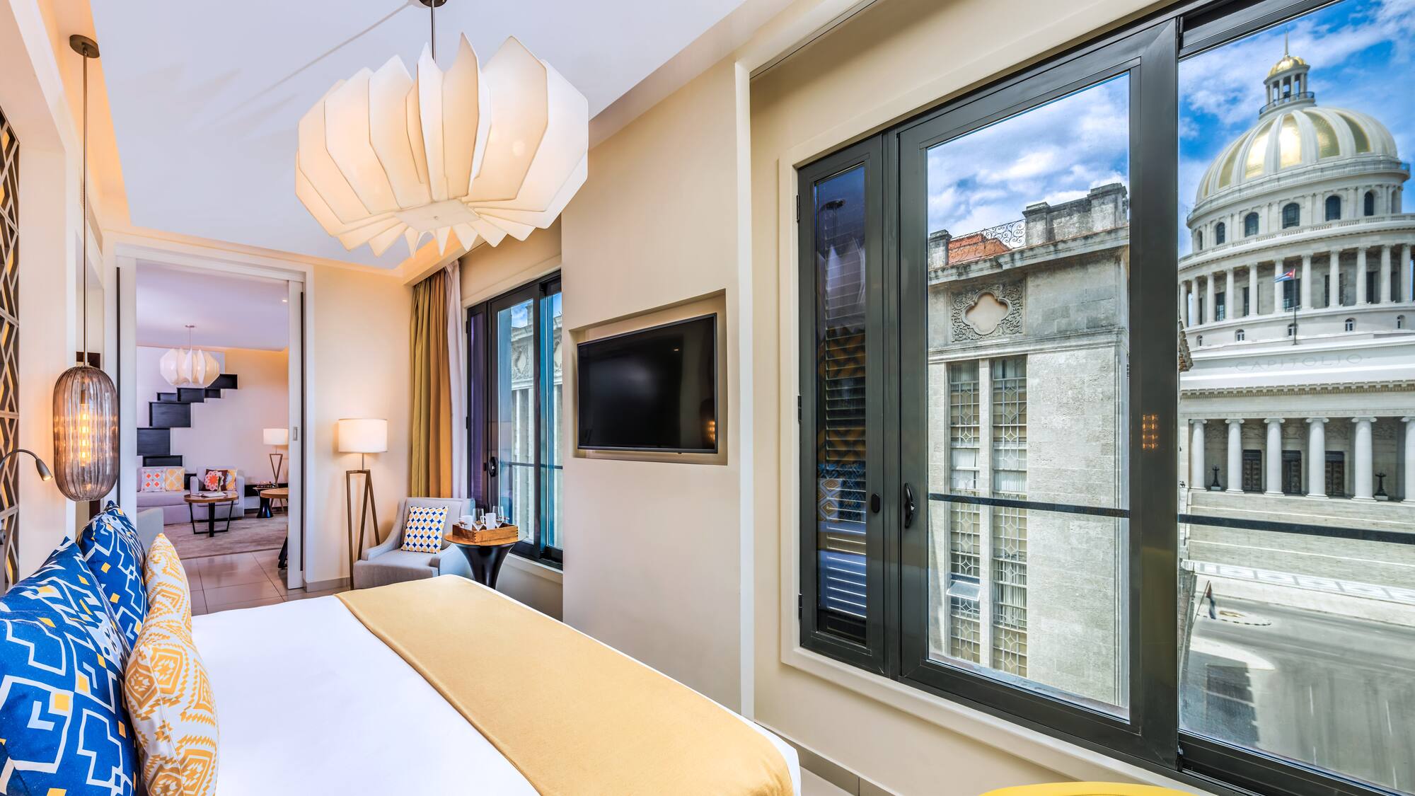 a bedroom with a television and a bed