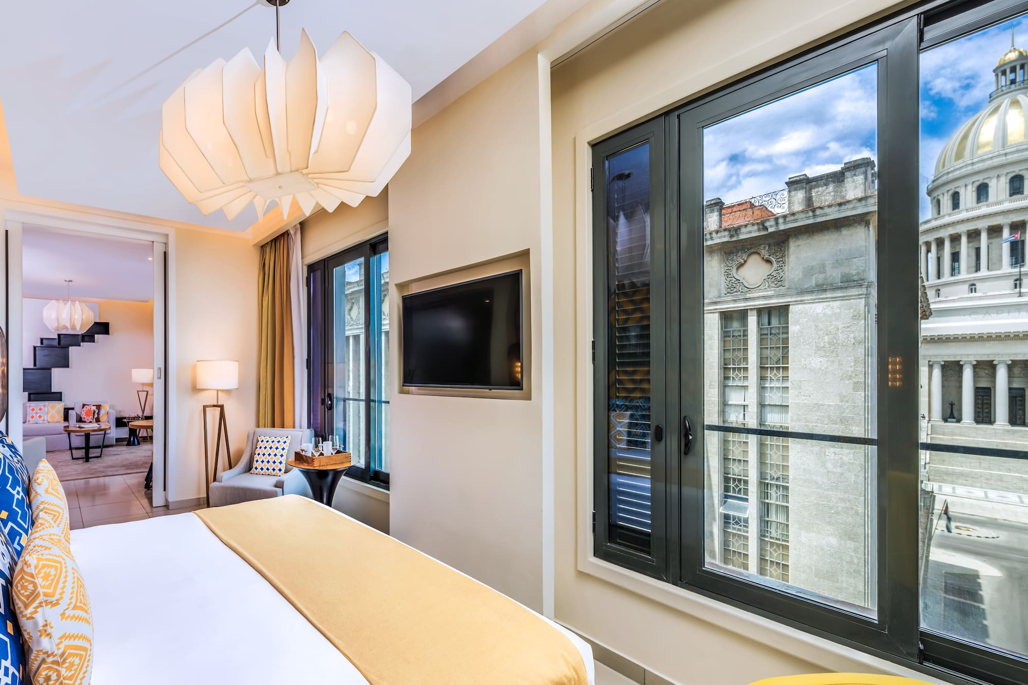 a bedroom with a television and a bed