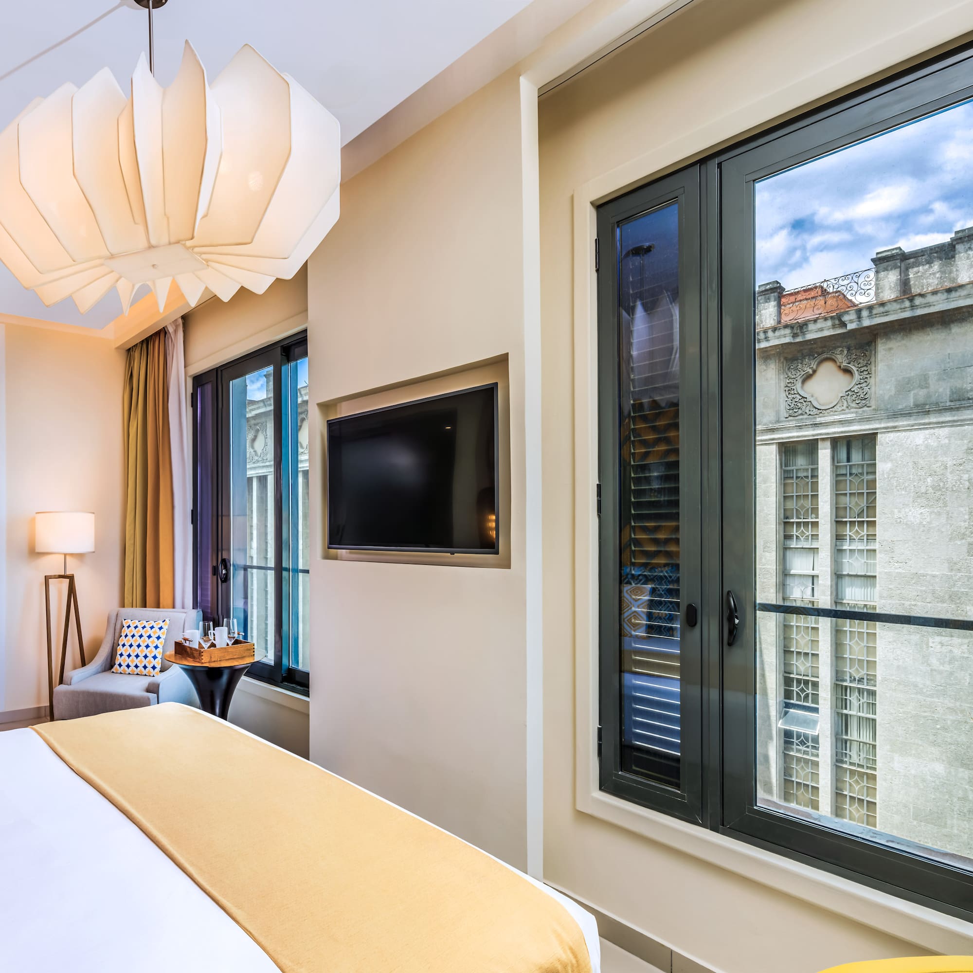 a bedroom with a television and a bed