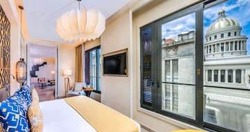 a bedroom with a television and a bed