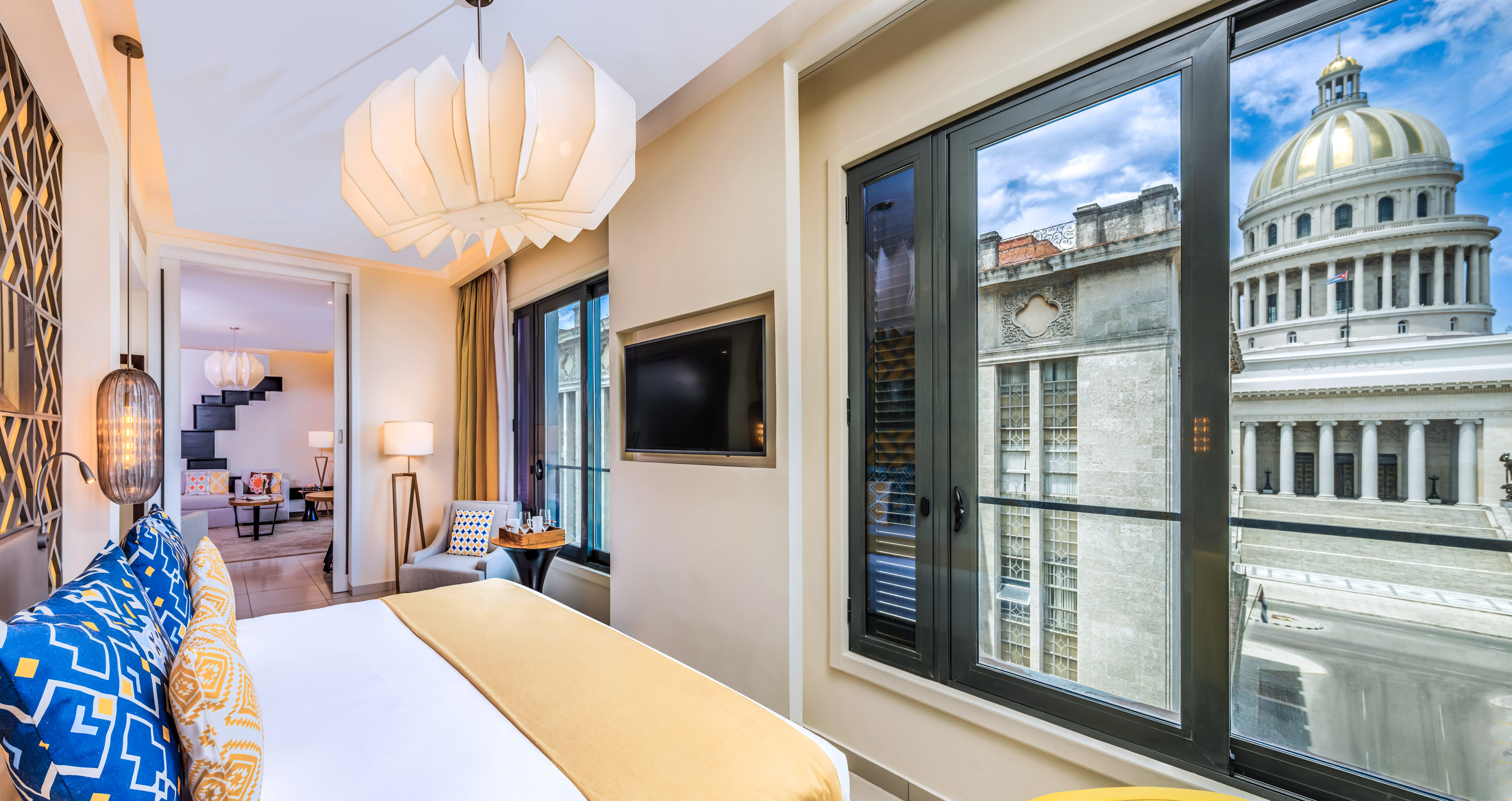 a bedroom with a television and a bed