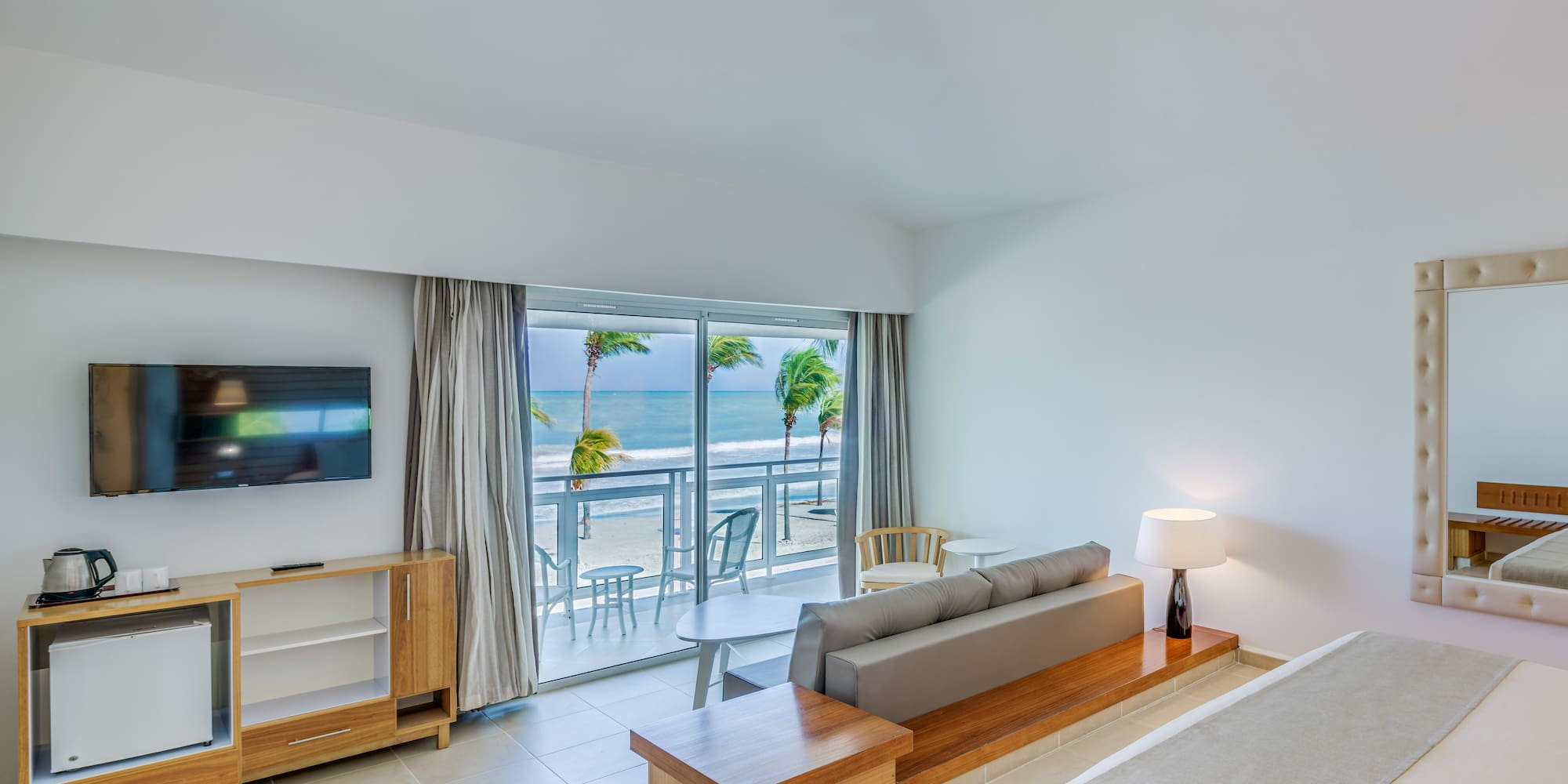 a room with a bed and a television and a table