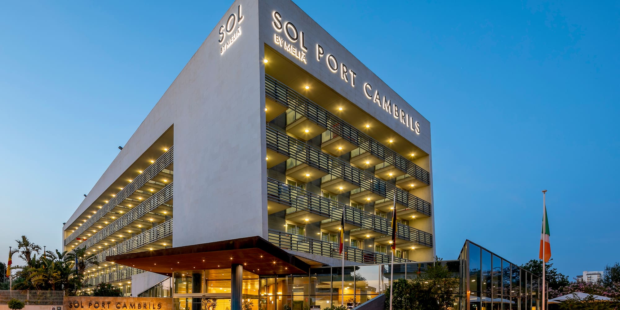 a building with many windows and a sign on the front