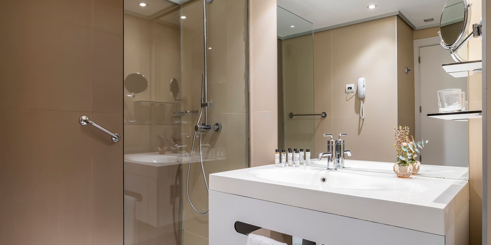 a bathroom with a shower and sink