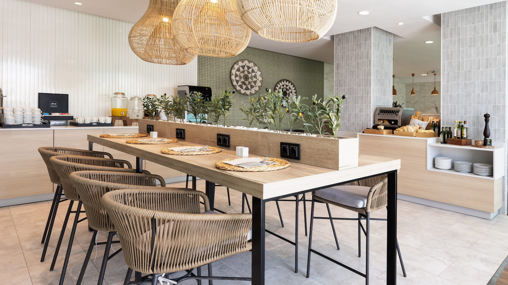 a dining table with chairs and a table with plates and a plant