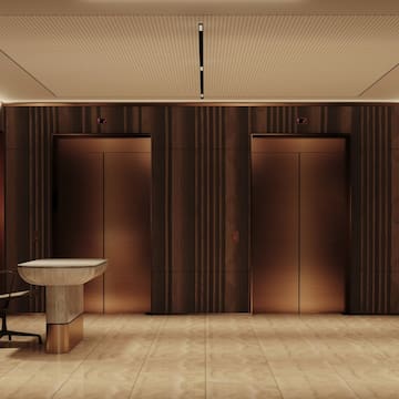 a room with two elevators and a sink