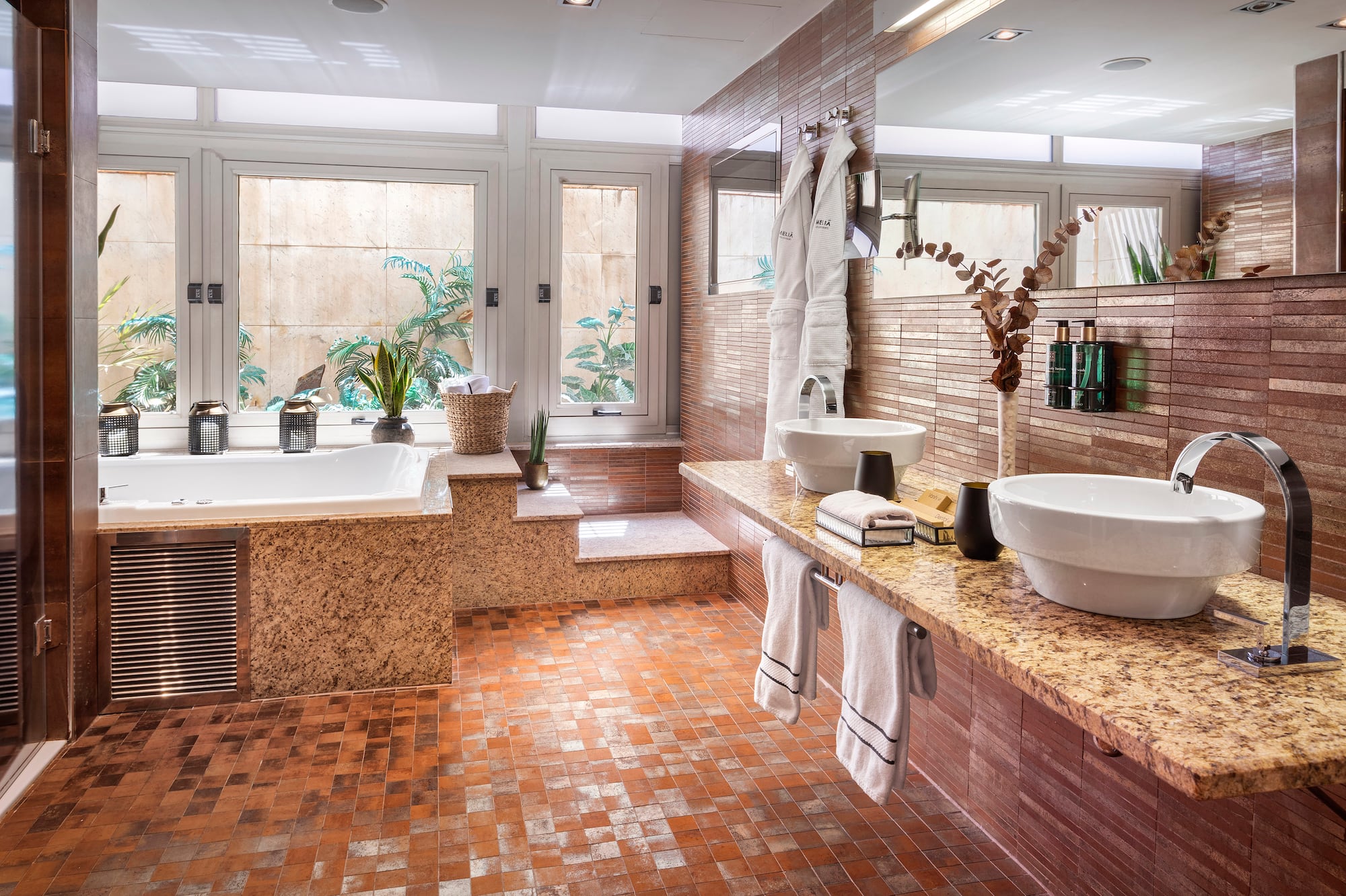 a bathroom with a tub and sink