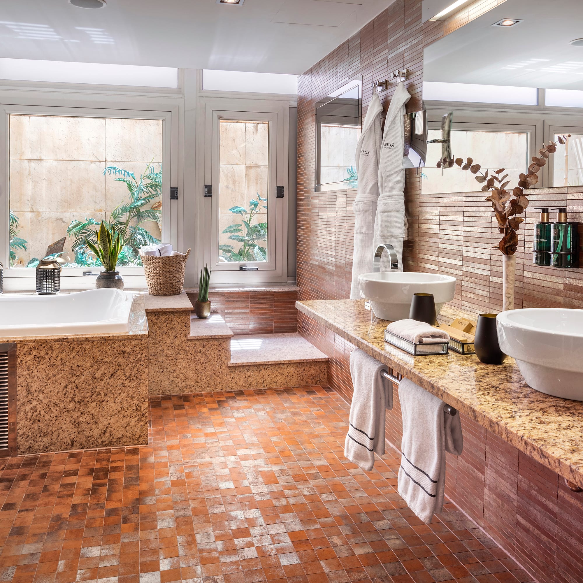 a bathroom with a tub and sink