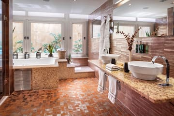 a bathroom with a tub and sink