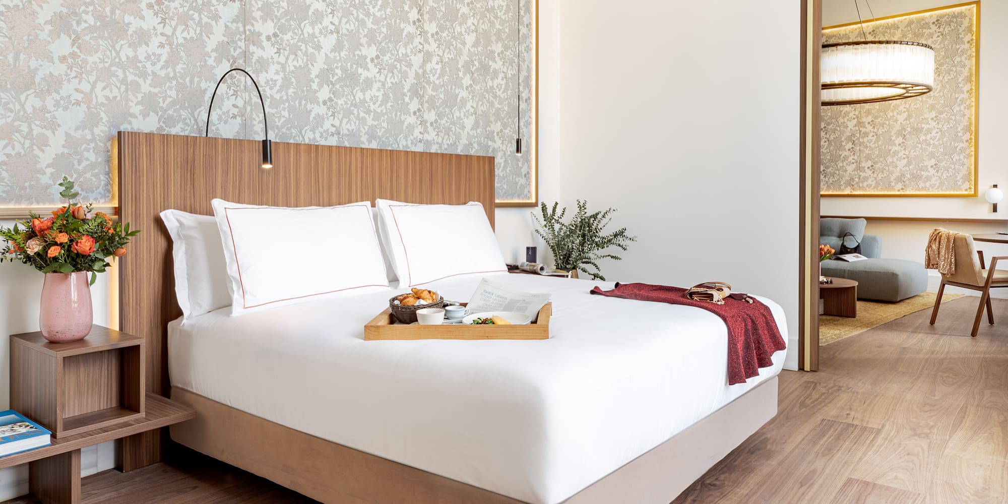 a bed with a tray of food on it