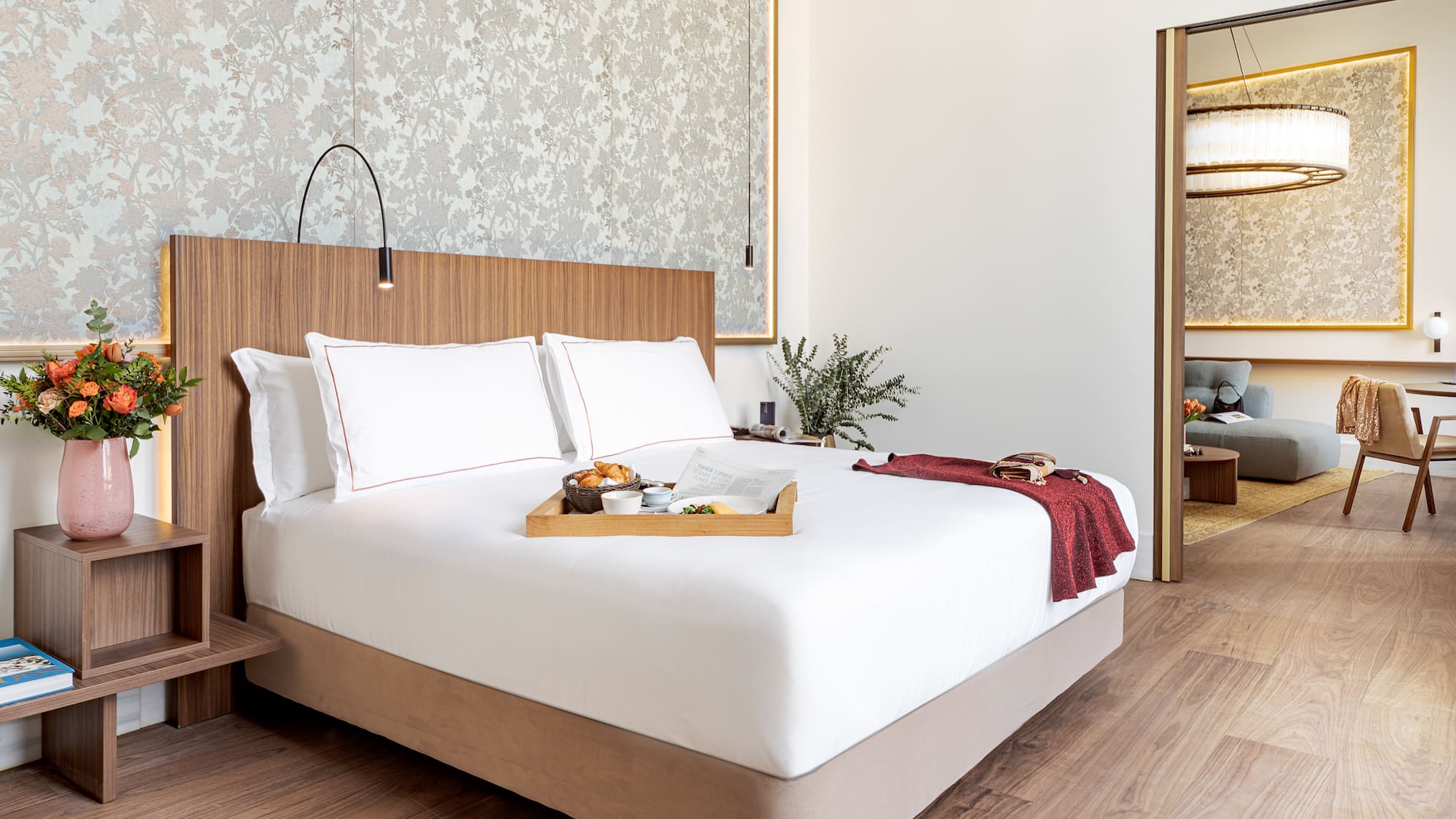 a bed with a tray of food on it