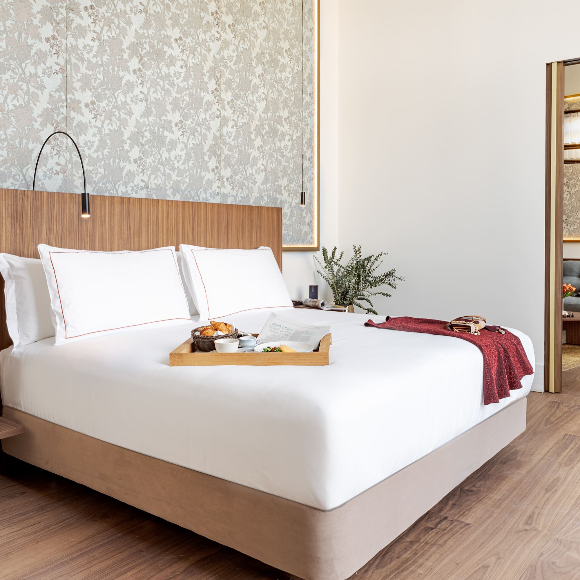 a bed with a tray of food on it