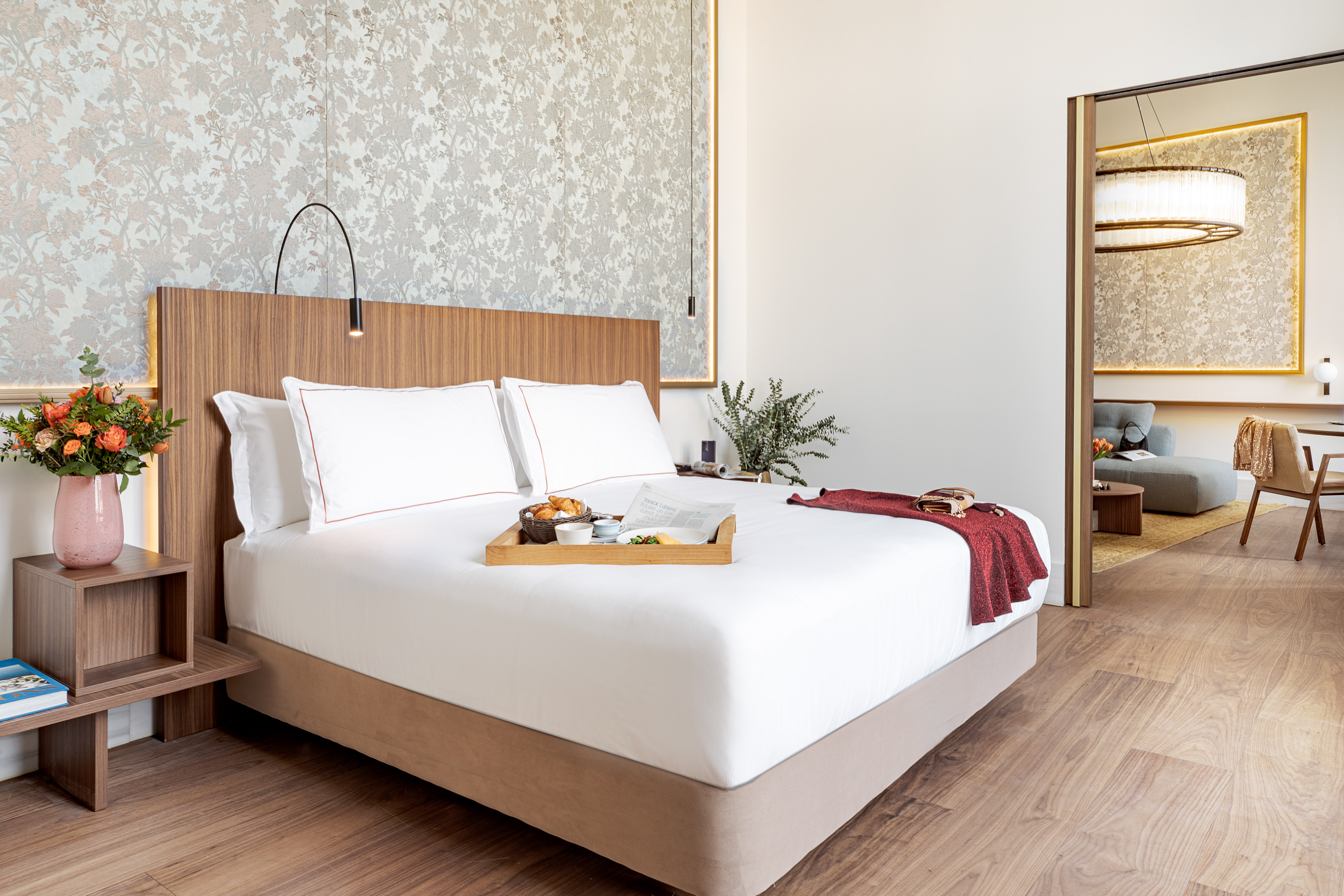 a bed with a tray of food on it