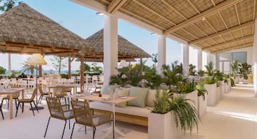 a patio with a table and chairs