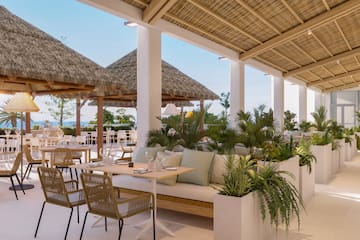 a patio with a table and chairs