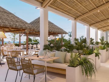 a patio with a table and chairs