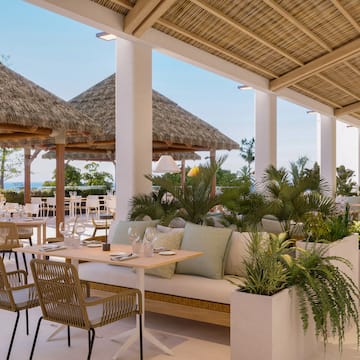 a patio with a table and chairs