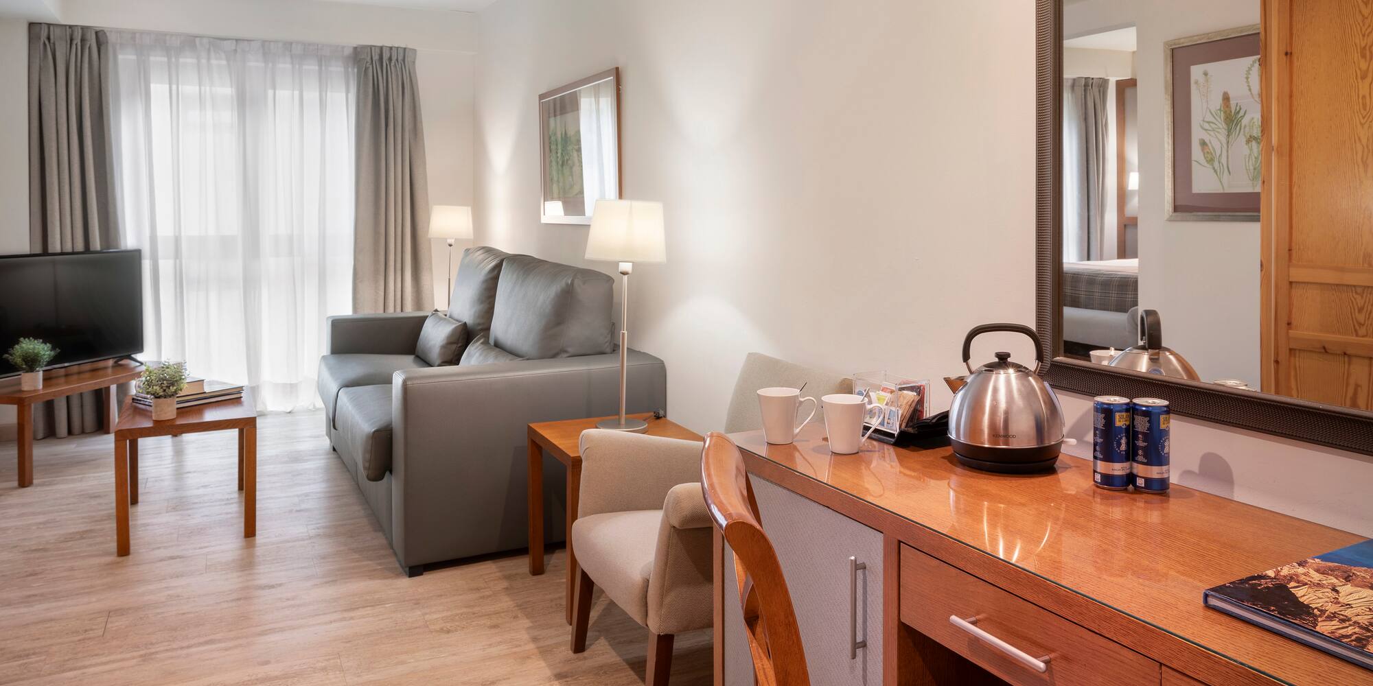 a room with a couch and a coffee pot