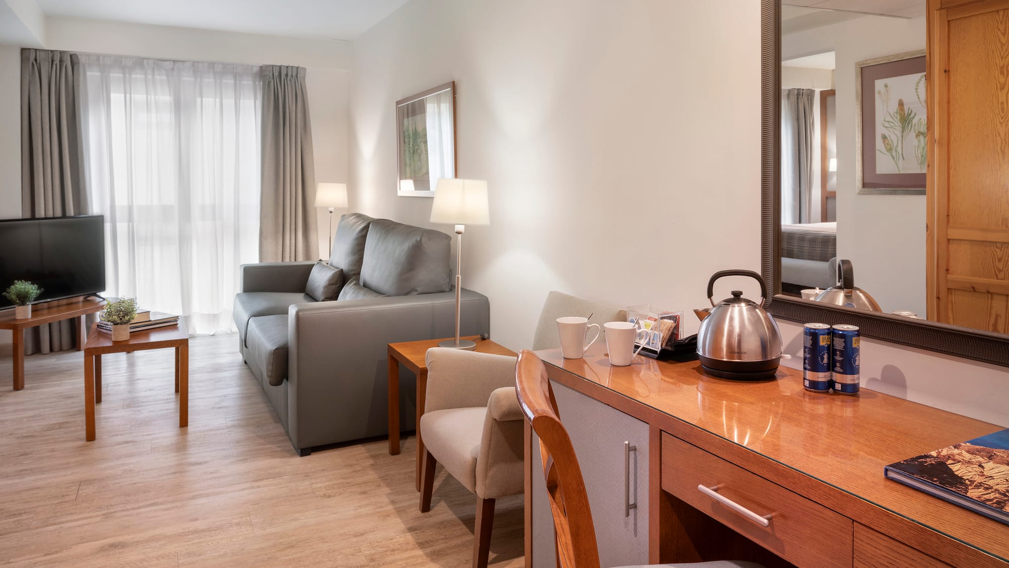 a room with a couch and a coffee pot