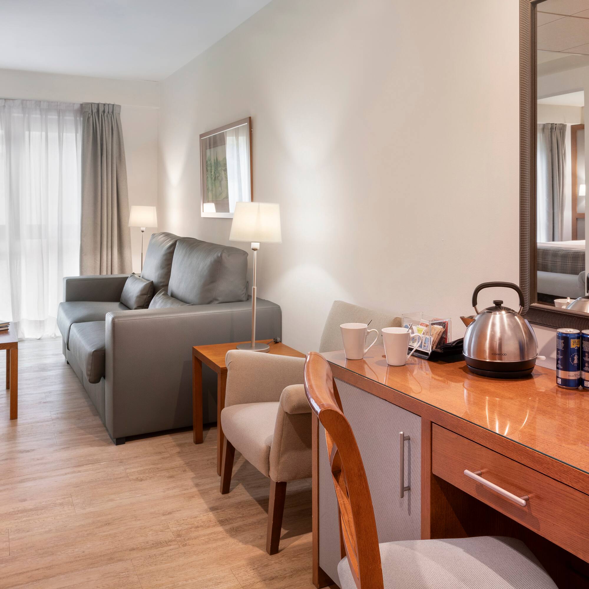 a room with a couch and a coffee pot