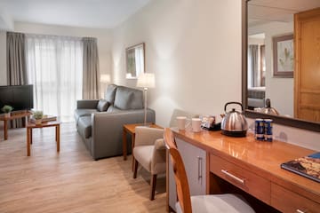 a room with a couch and a coffee pot