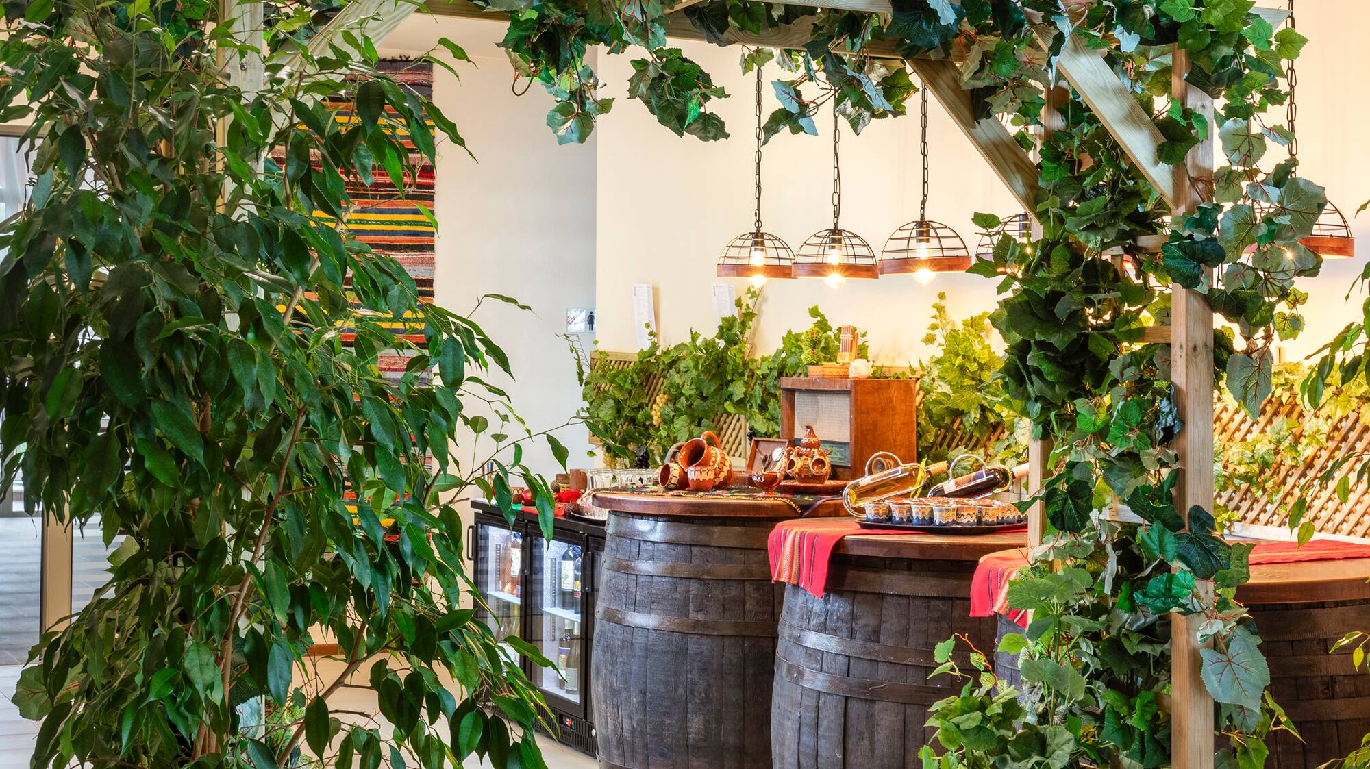 a wooden structure with barrels and a sign