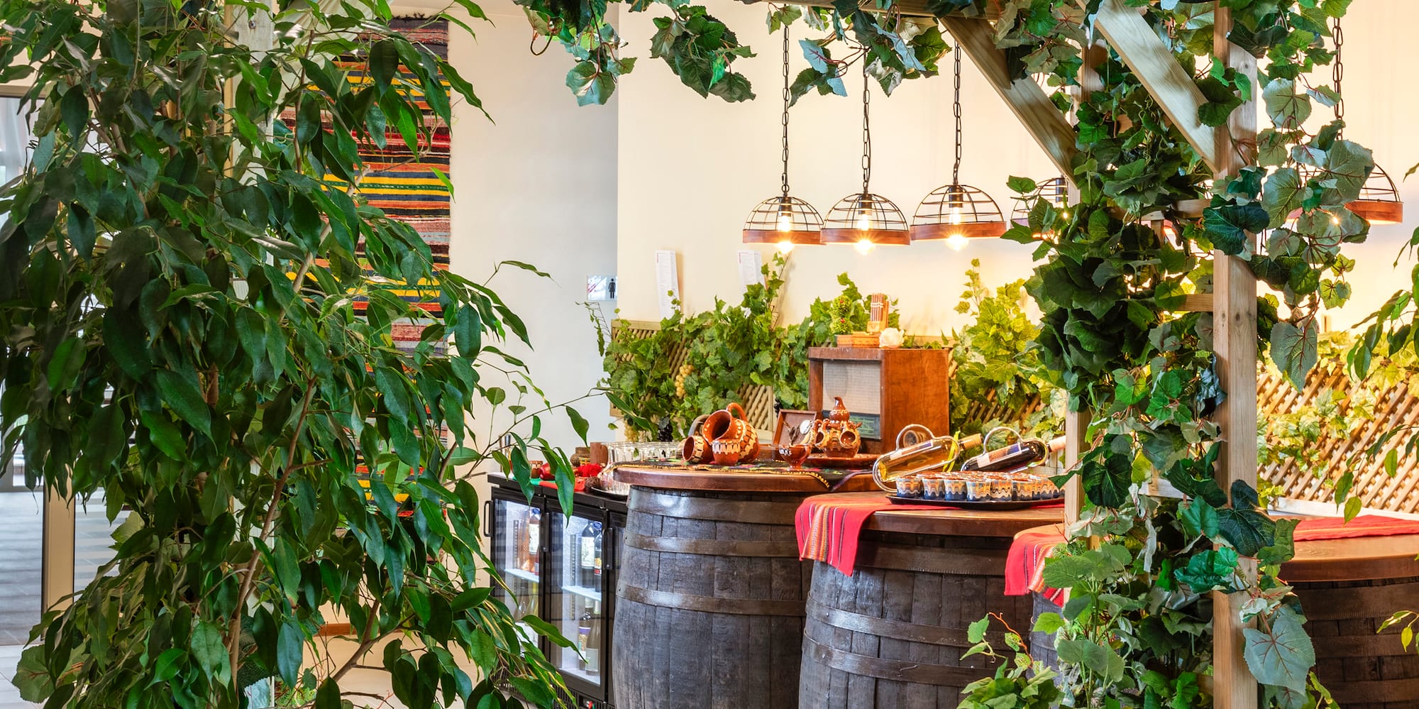 a wooden structure with barrels and a sign