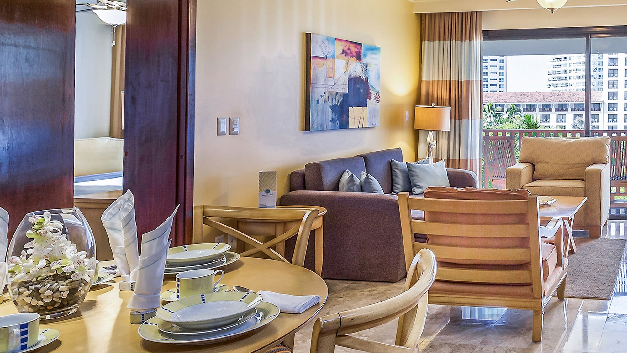 a living room with a table and chairs