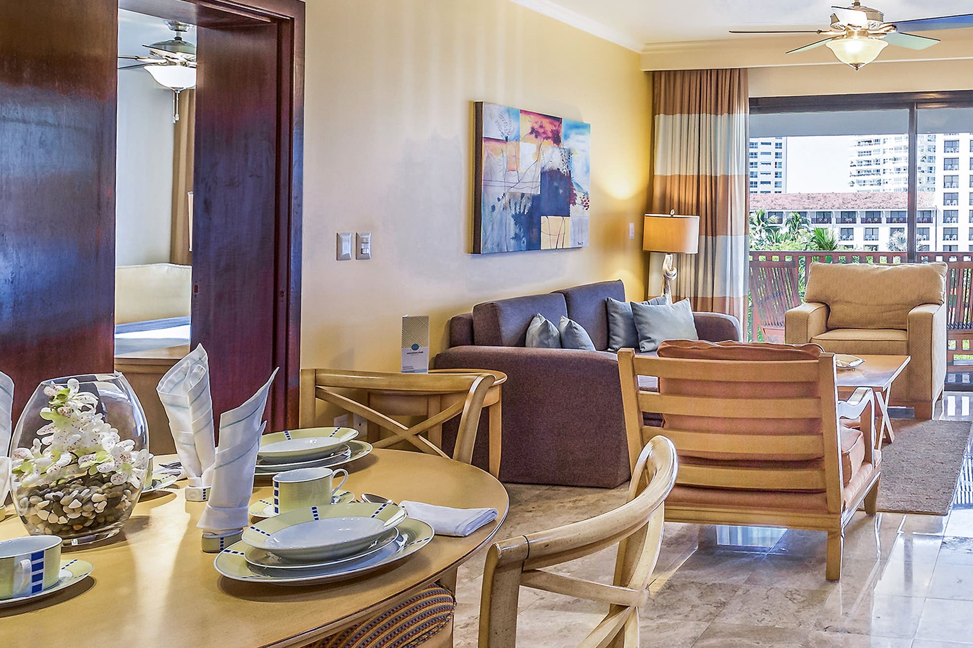 a living room with a table and chairs