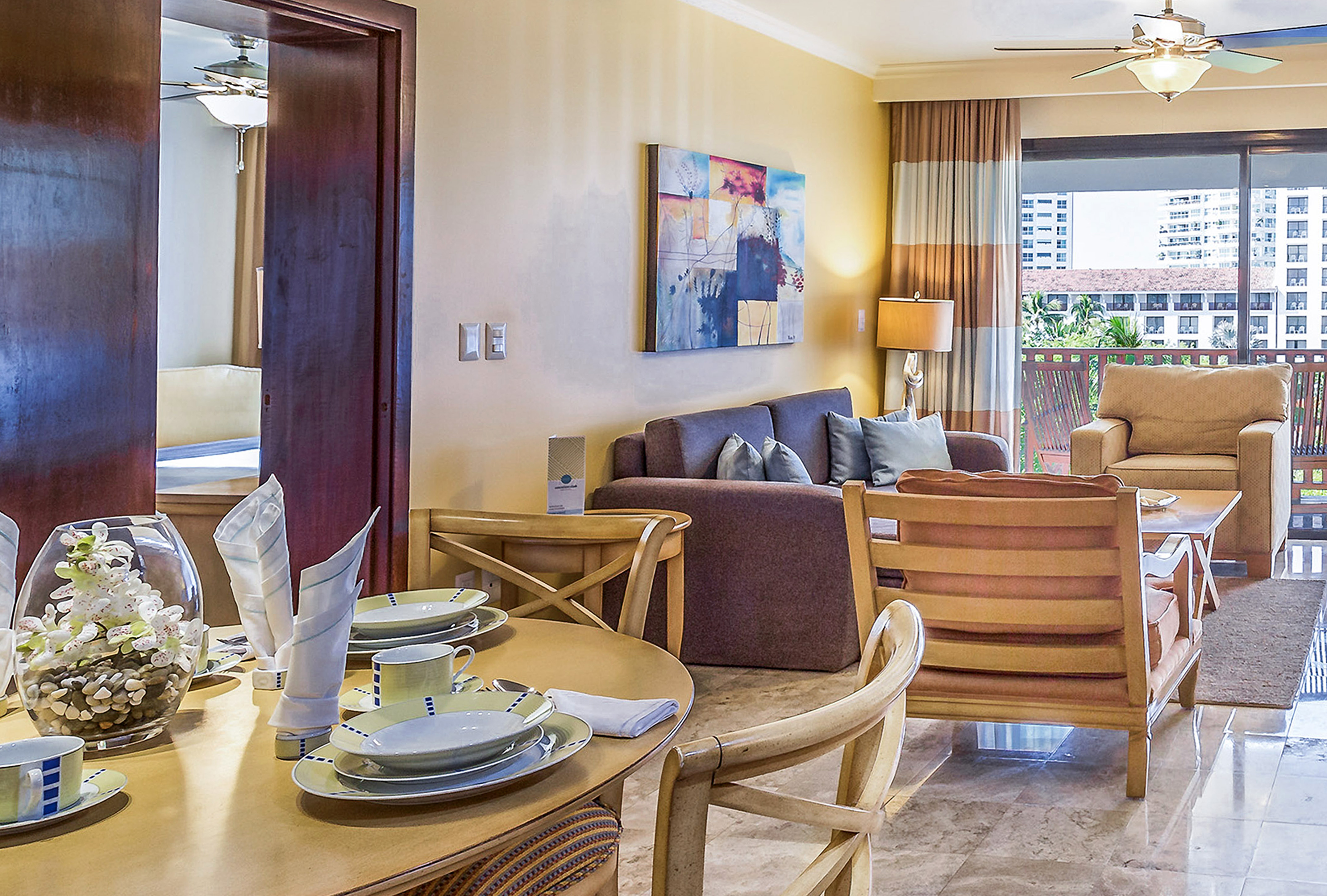 a living room with a table and chairs