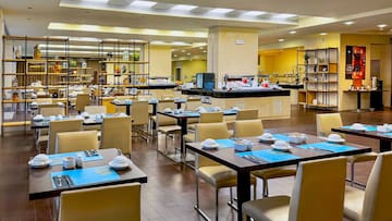 a restaurant with tables and chairs