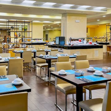 a restaurant with tables and chairs