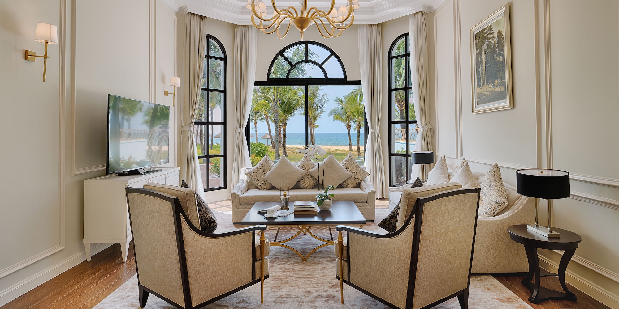 a living room with a large window and a couch and a table