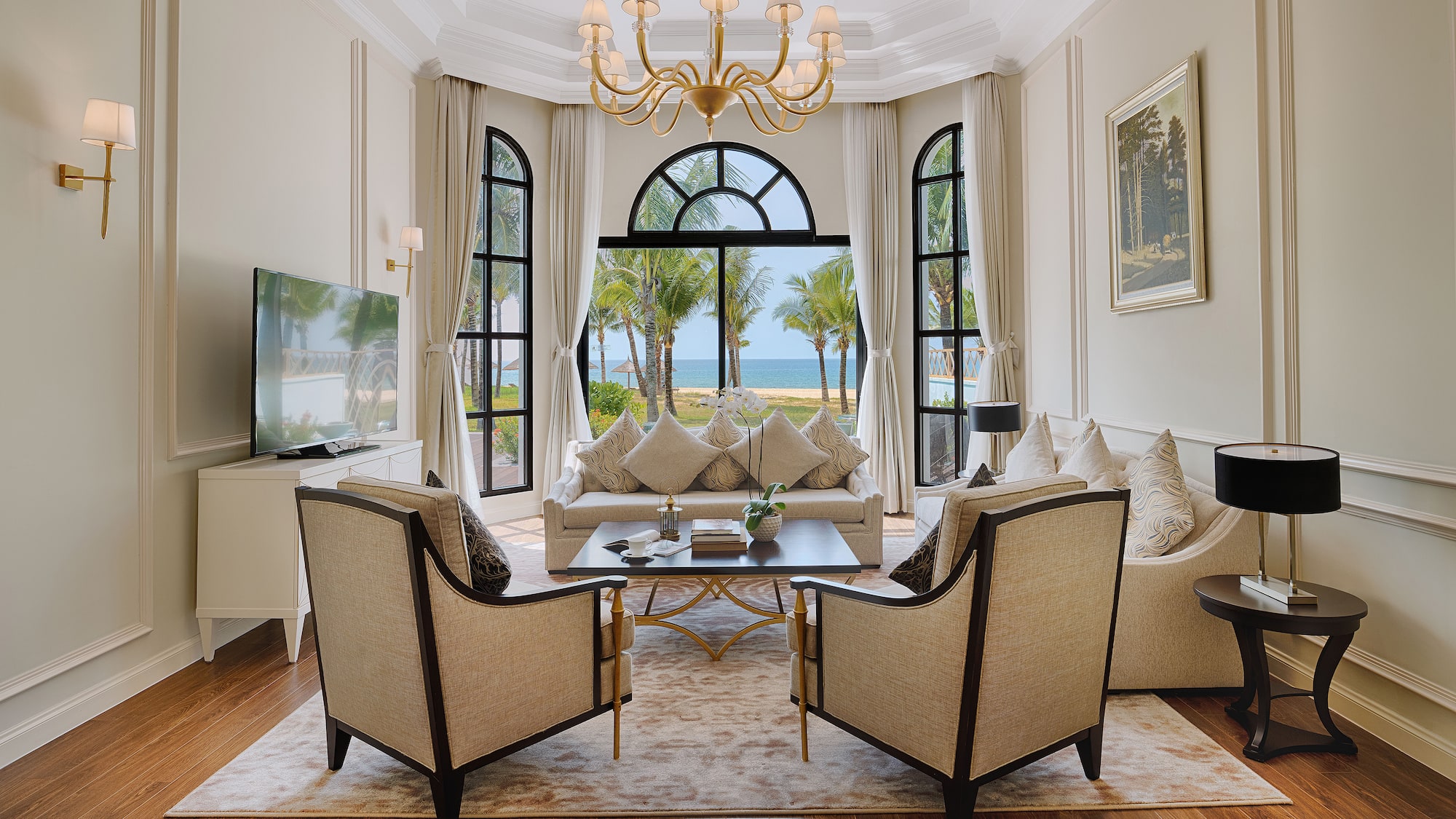 a living room with a large window and a couch and a table