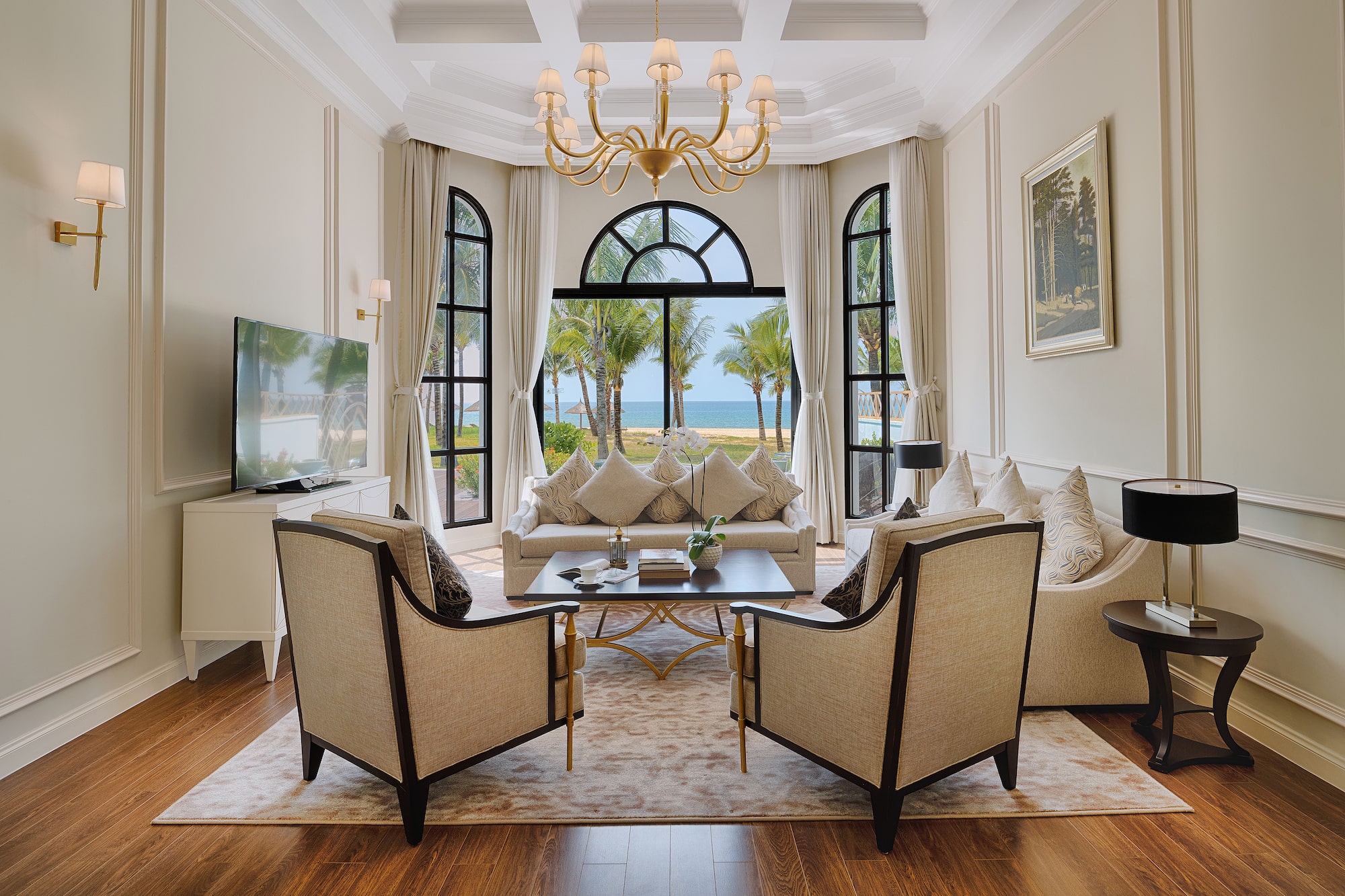 a living room with a large window and a couch and a table