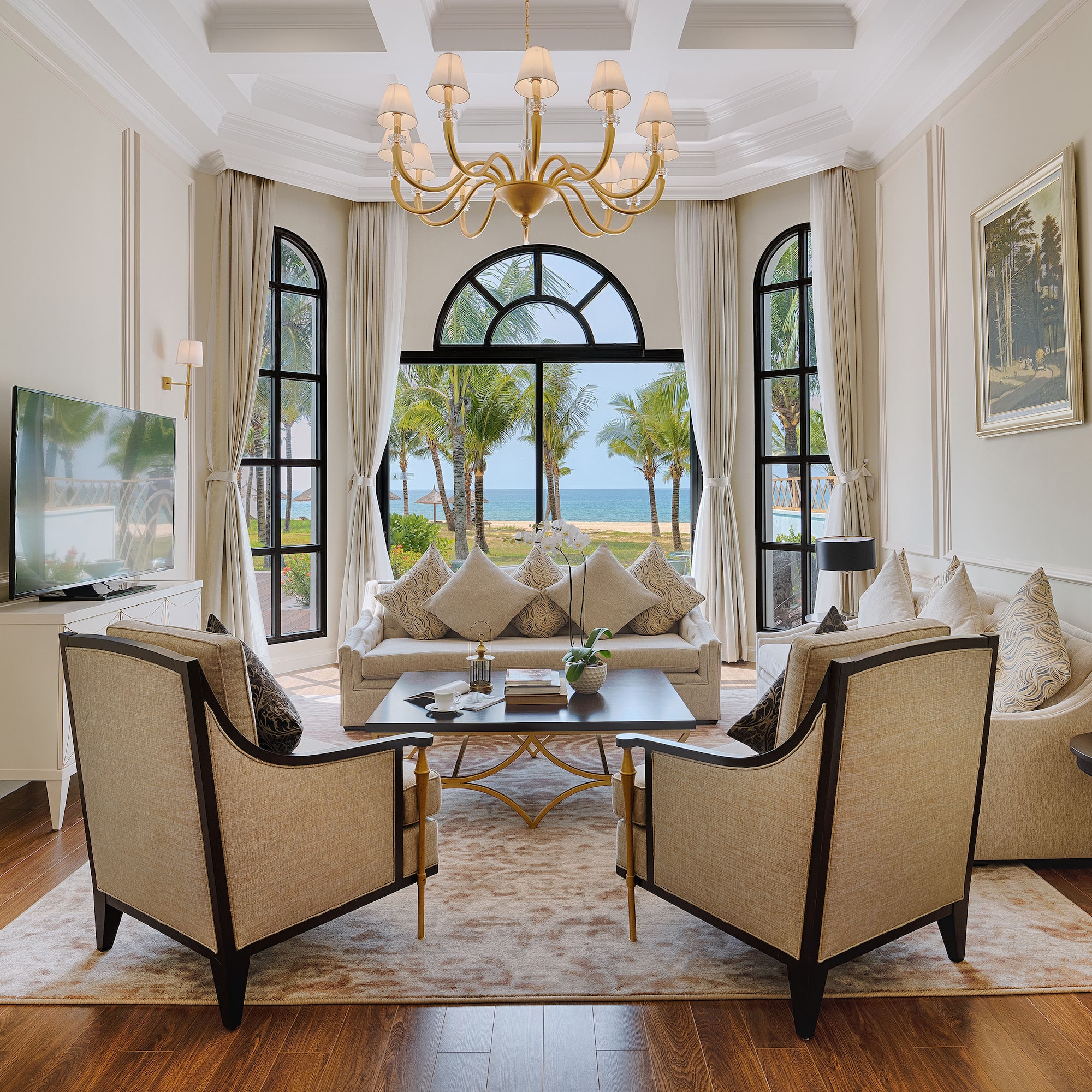 a living room with a large window and a couch and a table