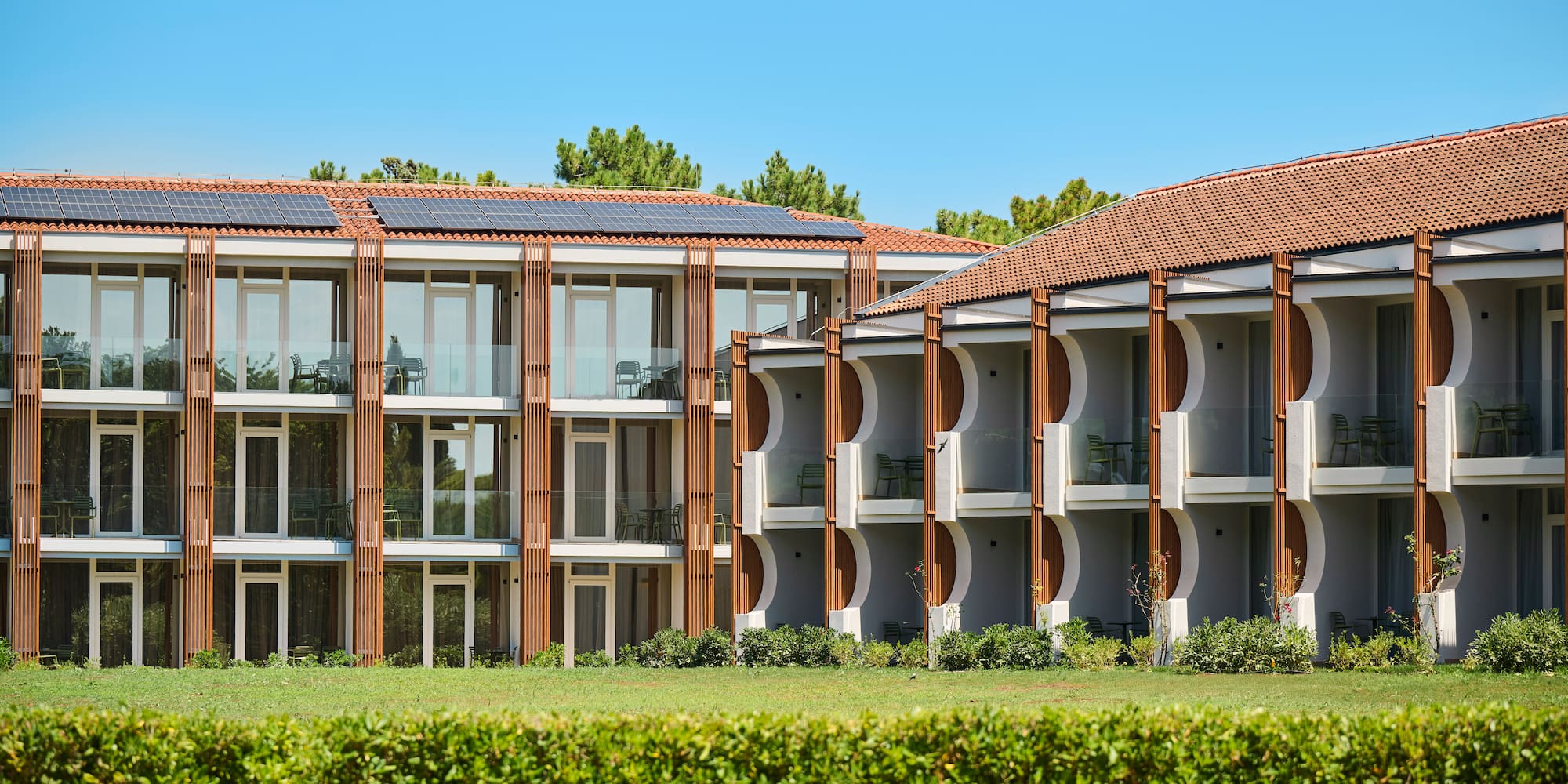 a building with a green lawn