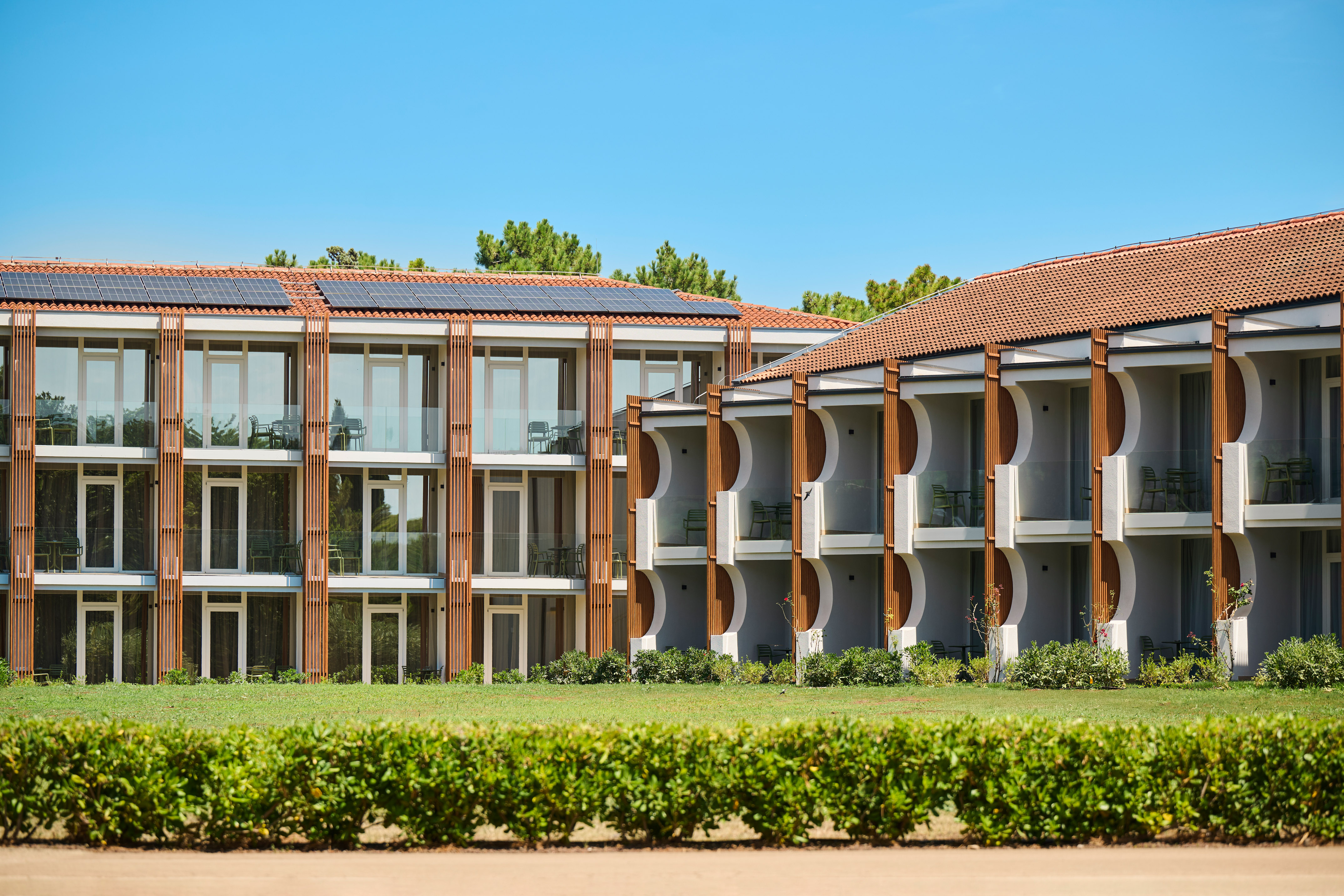 a building with a green lawn