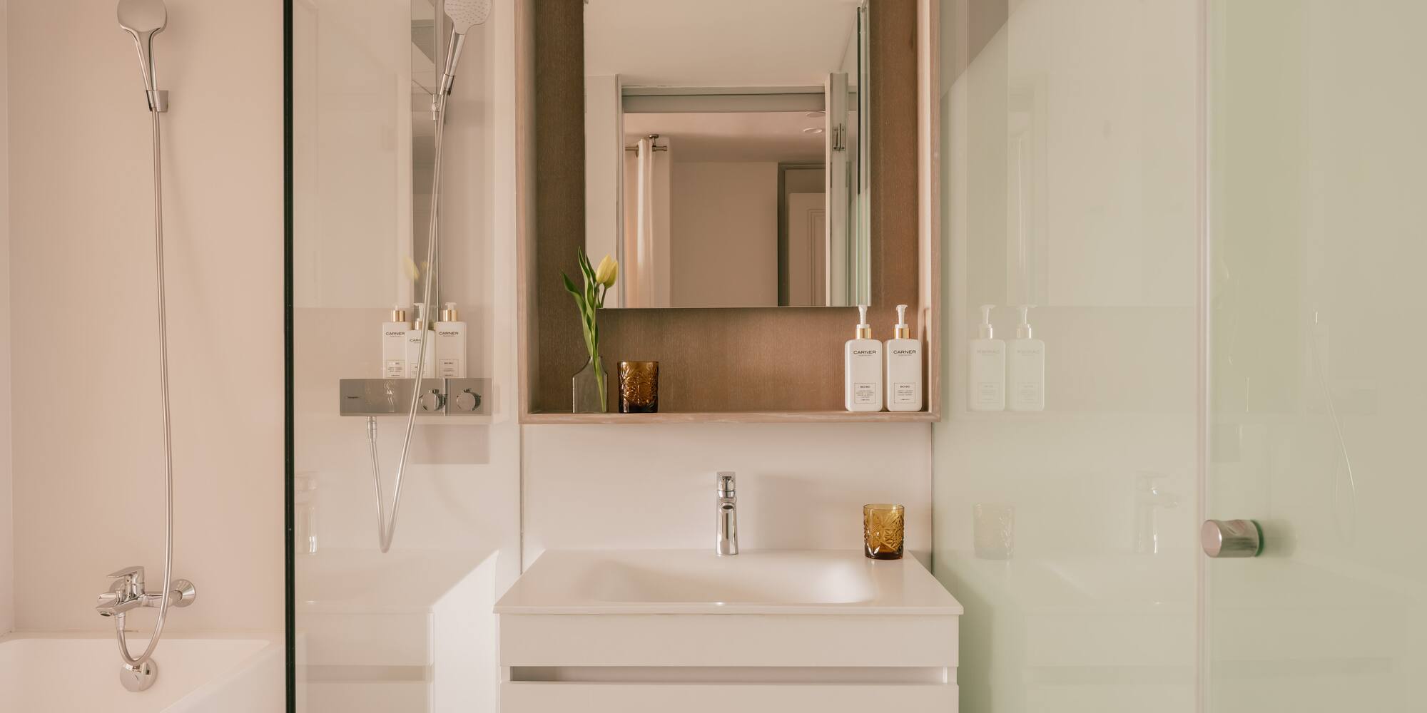 a bathroom with a mirror and sink