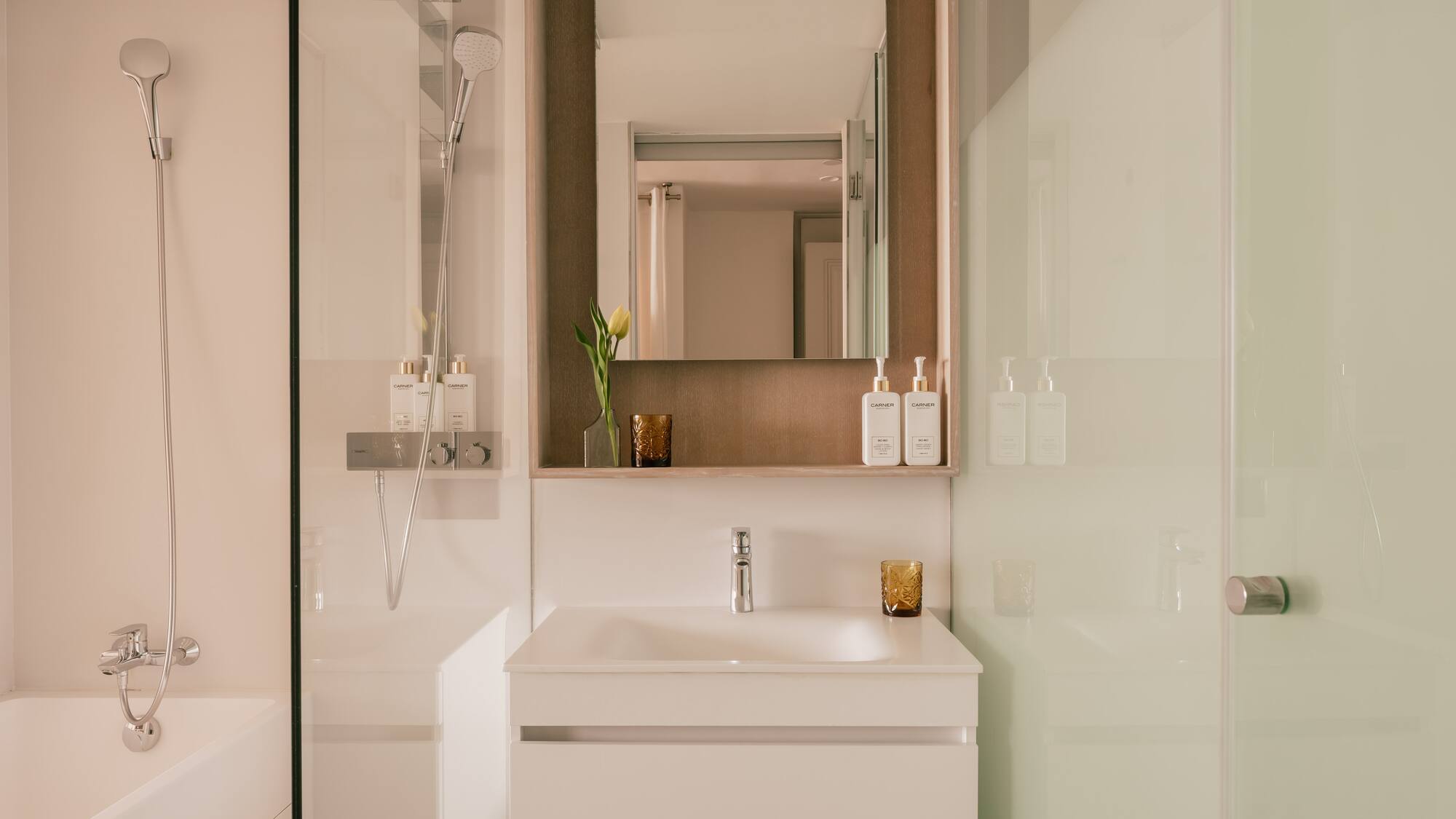 a bathroom with a mirror and sink