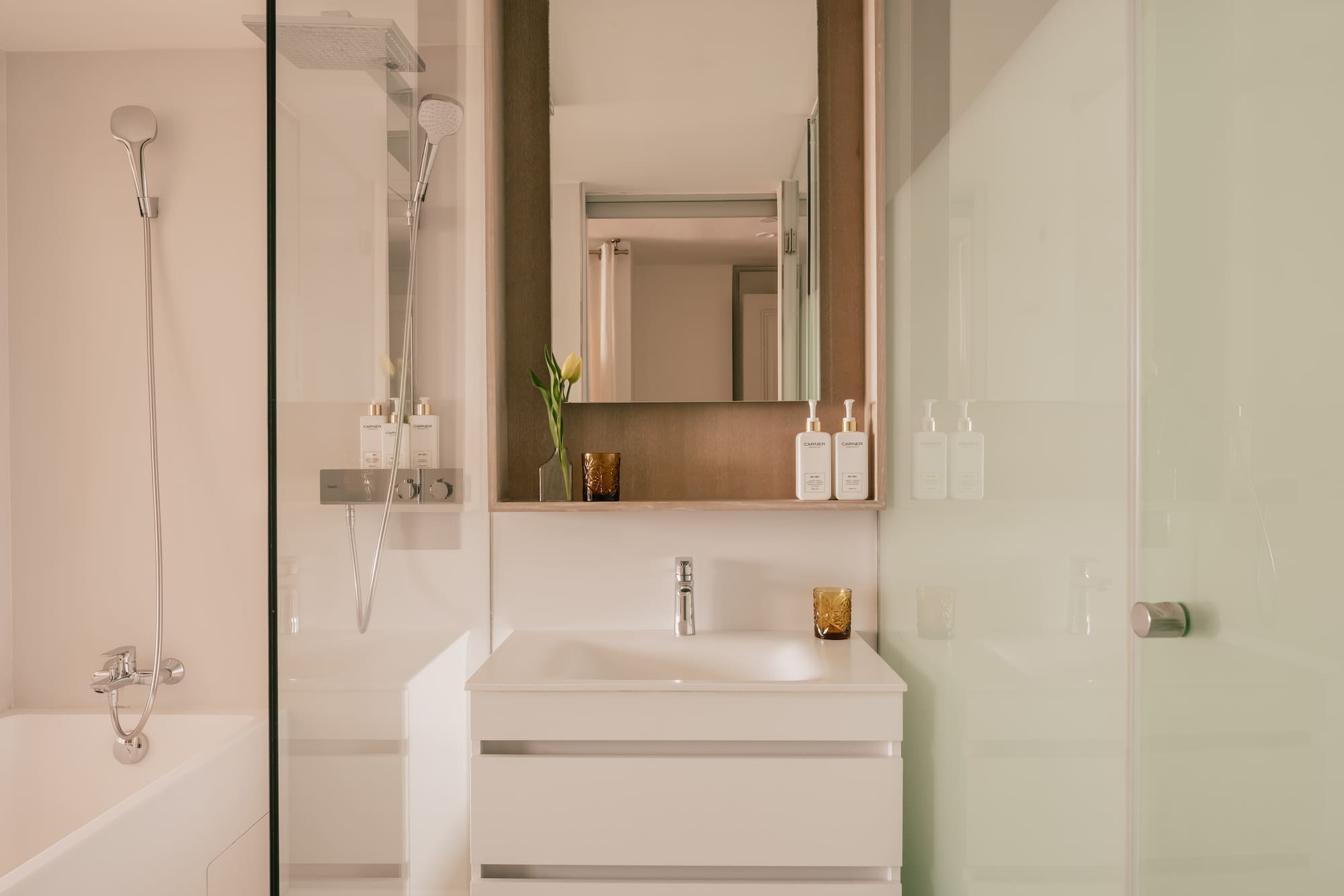 a bathroom with a mirror and sink