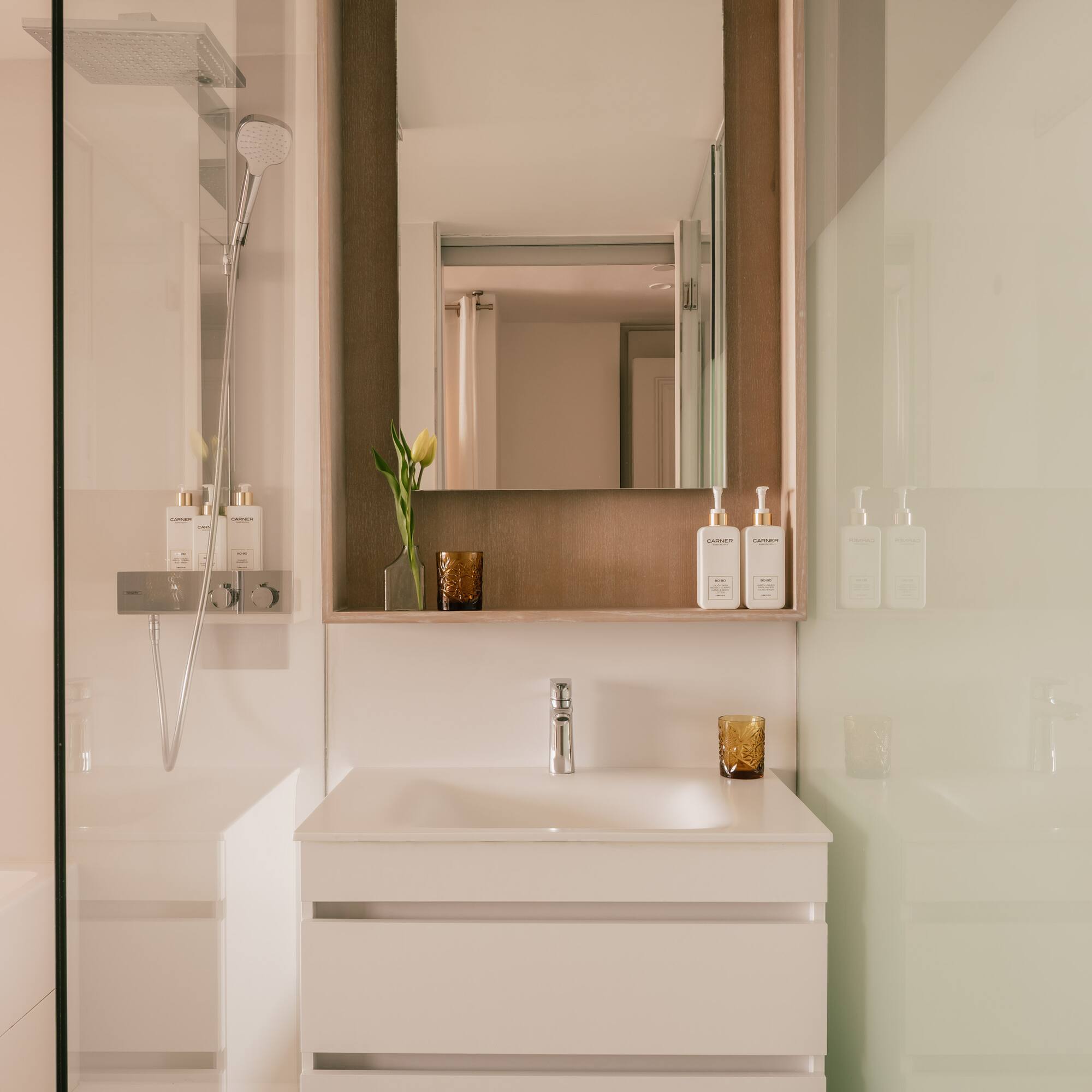 a bathroom with a mirror and sink