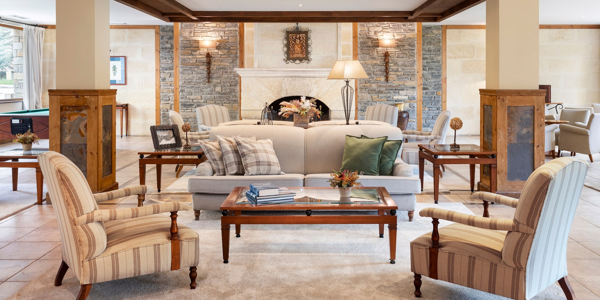 a living room with a fireplace and couches