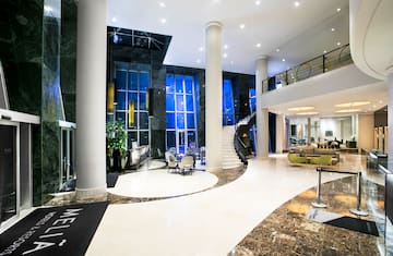 a lobby with a staircase and a staircase