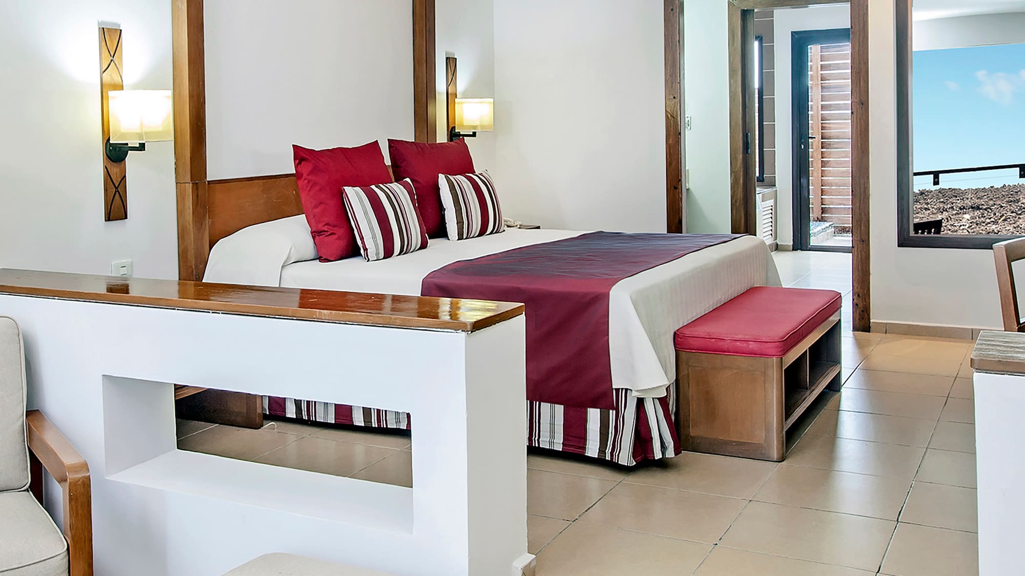 a bedroom with a bed and a couch