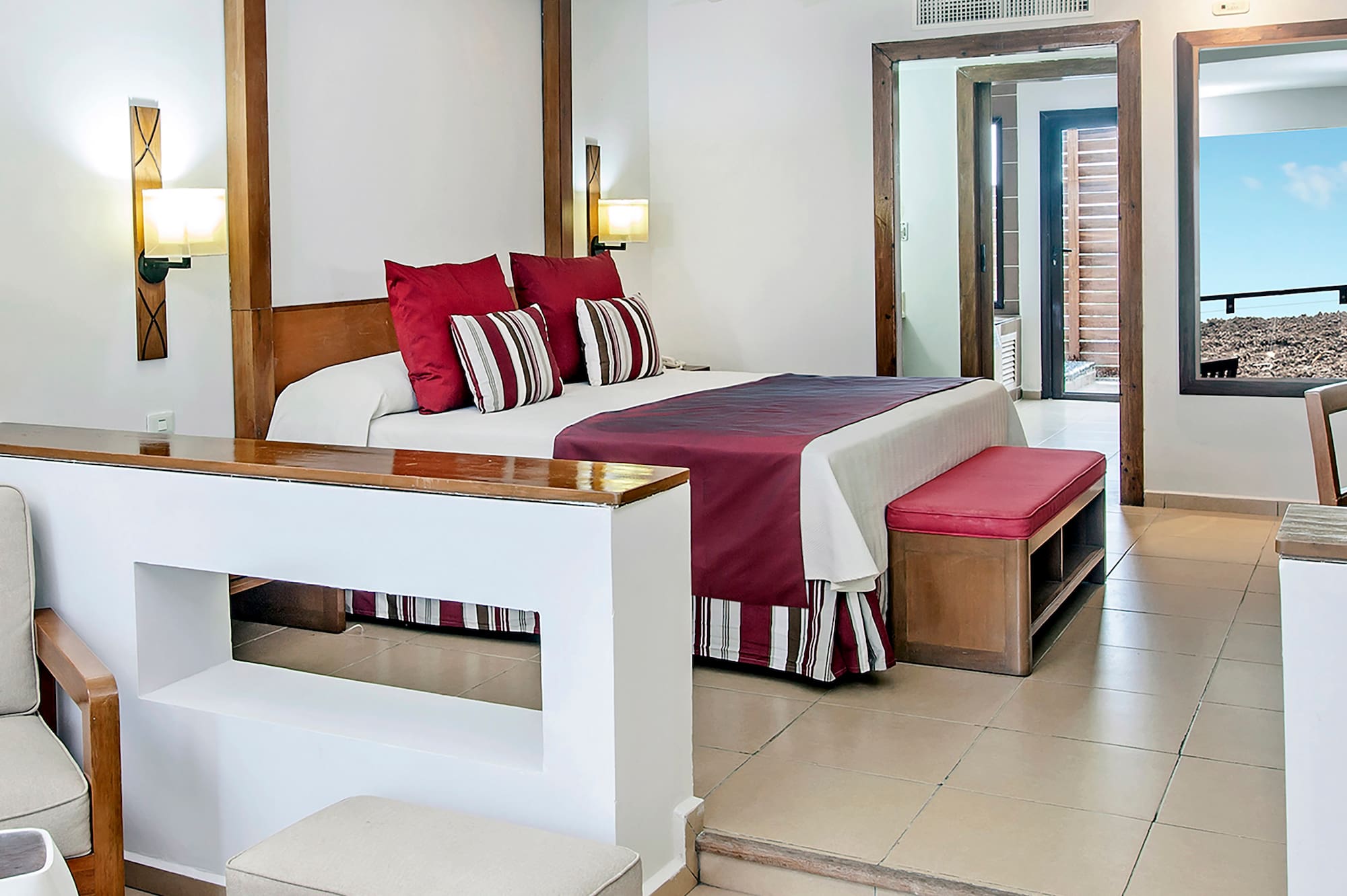 a bedroom with a bed and a couch