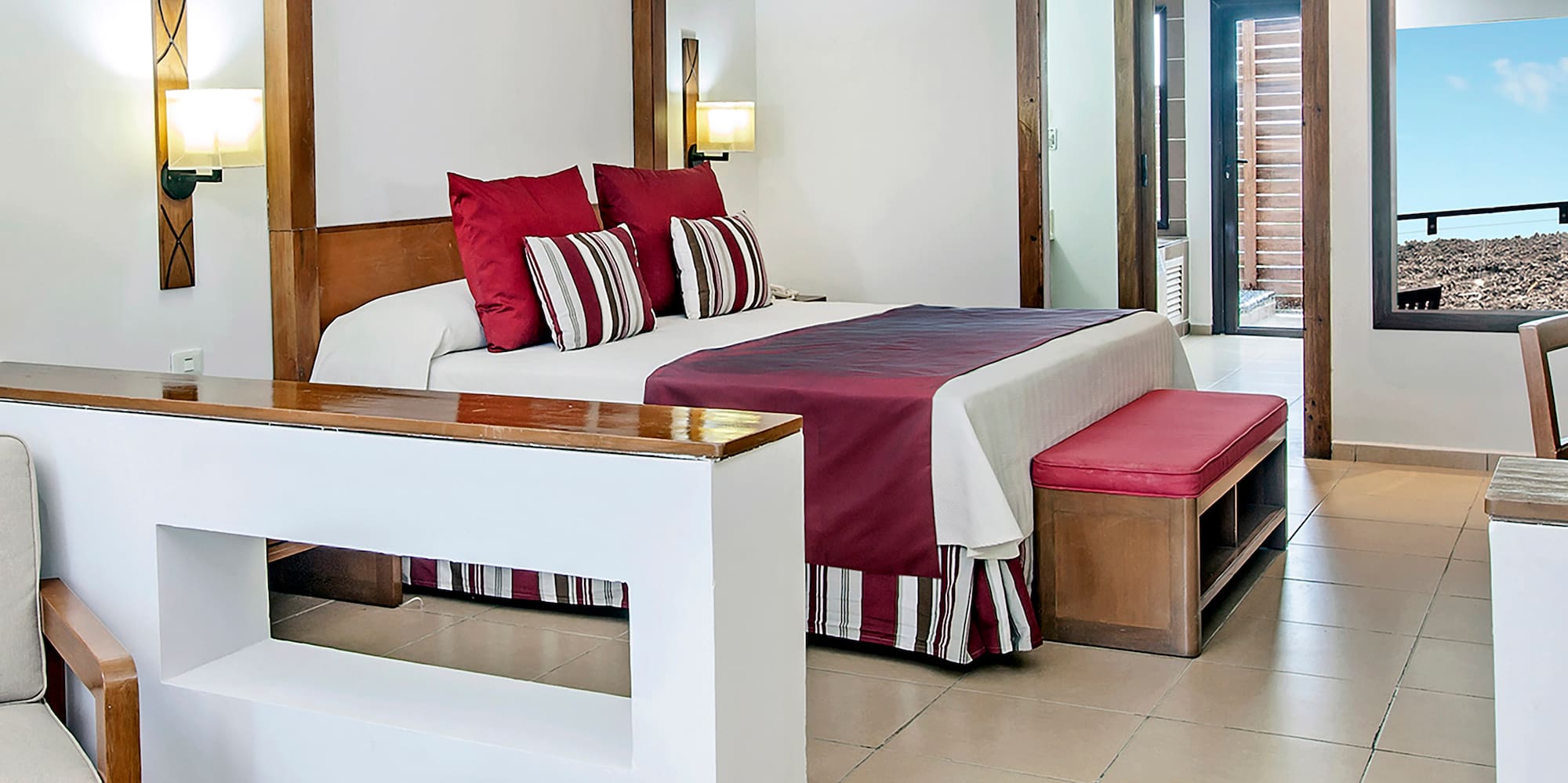 a bedroom with a bed and a couch