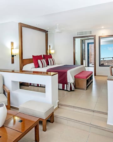 a bedroom with a bed and a couch