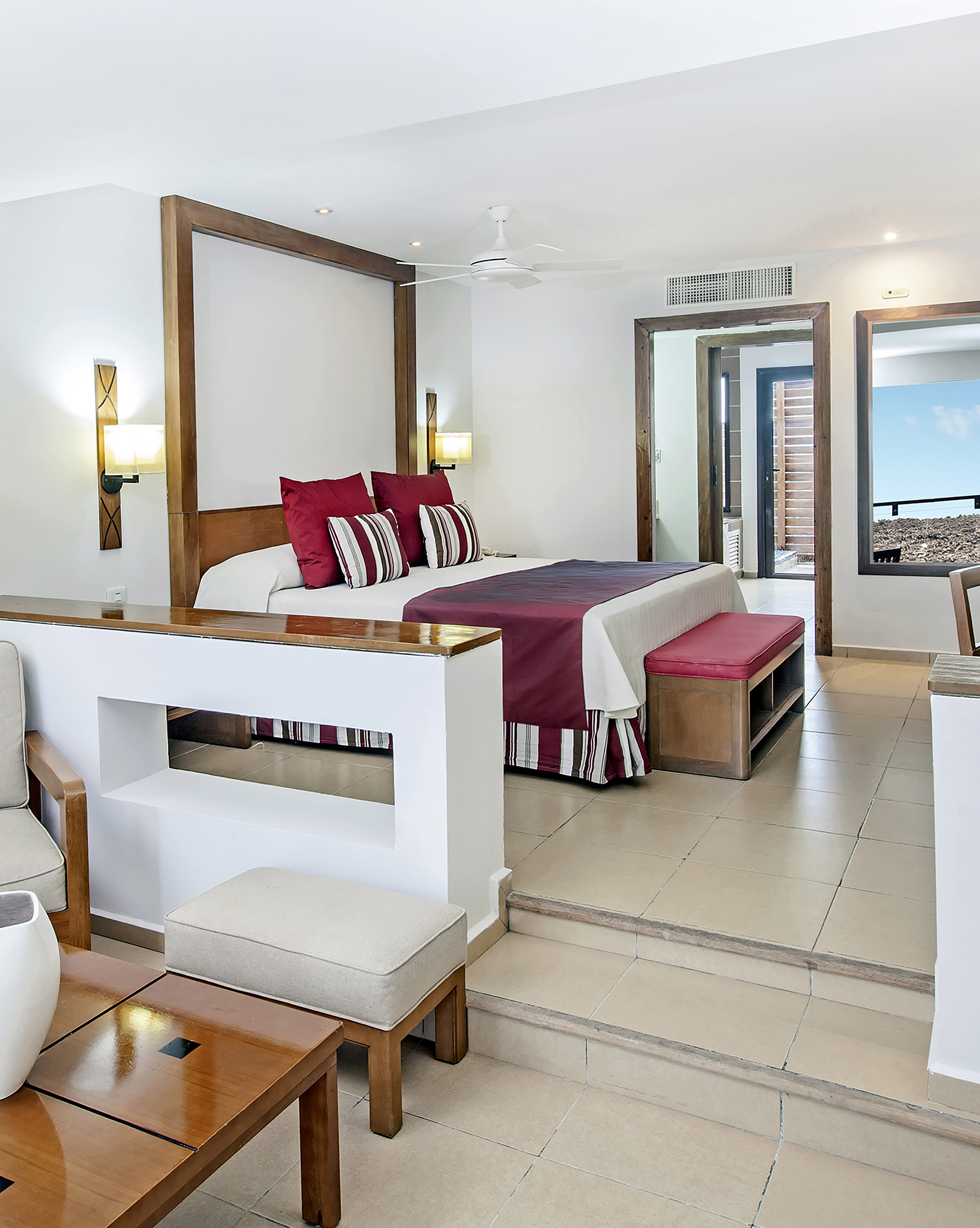 a bedroom with a bed and a couch