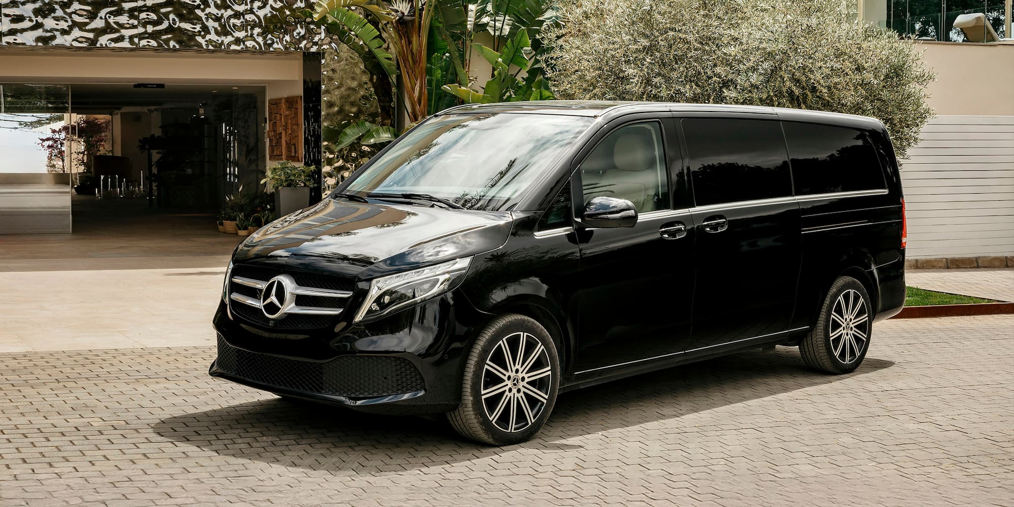 a black van parked in front of a building
